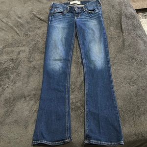 Size 5 low rise dark wash denim jeans. Boot cut style